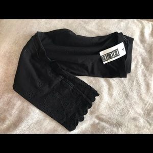 Black women’s leggings with eyelet detail